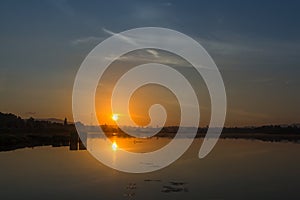 Landscape of reflexion sunrise with cloudy over lake in the morning of Thailand