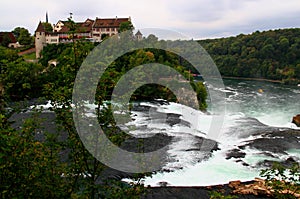 Landscape with the Rheinfall waterfall and the Laufen castle near the town of Neuhausen in Switzerland