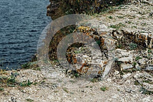 Landscape river cliff grass on the sky background