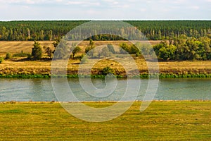 Landscape with river, field and forest