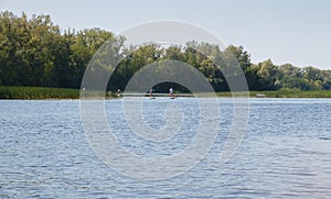 Landscape with a river people on boats