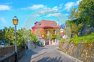 Landscape with road and colorful house in old city of Annecy. Haute Savoie, France