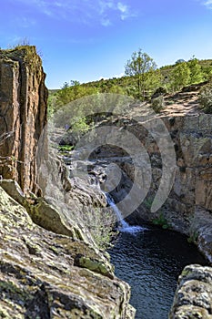 landscape of rock and water at the Aljibe waterfalls photo