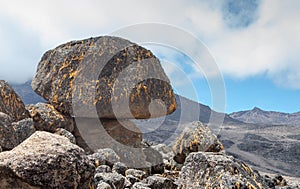 Landscape of rocks on Mount Kilimanjaro under sunlight with against cloudy sky