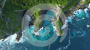 Landscape with rocks and ocean with waves in Indonesia. Aerial view