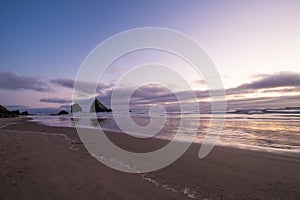 Landscape of rocks and the Pacific coast at sunset. Beautiful picture and night scenery of nature