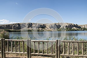 Landscape of rocks and water in the lagoon of the campillo in Rivas Vaciamadrid in Madrid Spain photo