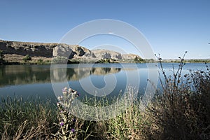 Landscape of rocks and water in the lagoon of the campillo in Rivas Vaciamadrid in Madrid Spain photo