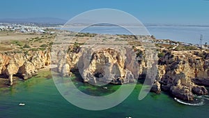 Landscape of rocky coastline and city