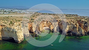 Landscape of rocky coastline and city