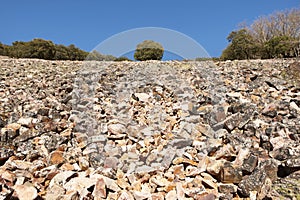 Landscape with rocky ground and trees in Cabaneros, Spain photo