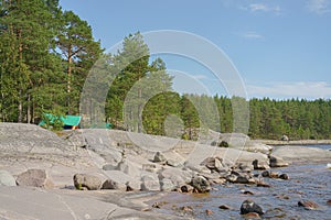 Landscape - Rocky lake shore on a summer day