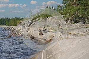 Landscape - Rocky lake shore on a summer day