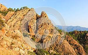 landscape of rocky roses rocks called  Badlands or Calanches in Corsica in France without people