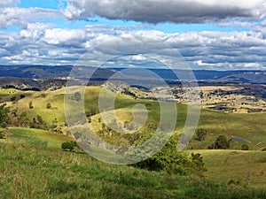 Landscape rolling hills Australian country with estates far view photo
