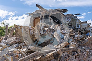 Landscape of ruined buildings, image of decrepitude or natural disaster. The house is destroyed. Destruction of old