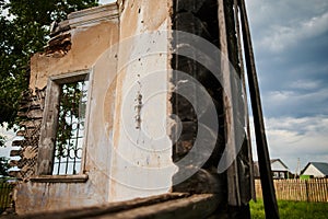 Landscape of ruined buildings at sunset, image of decrepitude or natural disaster.