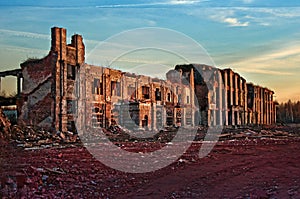 Landscape of ruined buildings at sunset, image of decrepitude or natural disaster