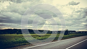 Landscape in Russia road field clouds forest