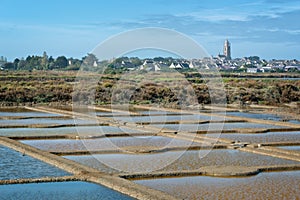 Landscape of salt marshes and village of Batz sur Mer near Guerande France photo