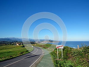 View on San Vicente de la Barquera, Cantabrian coastline with Picos de Europa mountain range photo