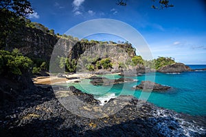 Landscape of the Sancho Beach surrounded by the sea in Brazil