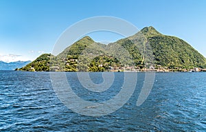 Landscape of Sasso del Ferro mountain that rises above town of Laveno Mombello, Italy