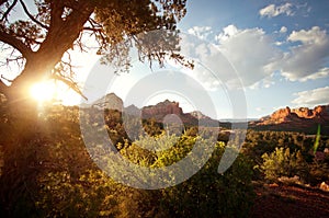 Landscape scene of red rock mountains with sunlight photo