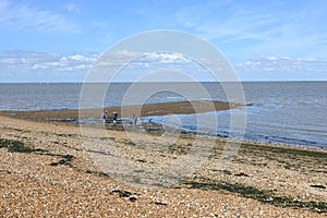 A landscape scene of the Tide going out at Tankerton Beach