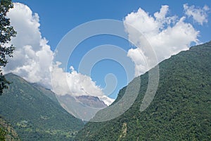 landscape and scenery of the Annnapurna base camp surrounded with green hills in sunny day