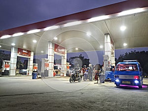 Landscape scenery at a gas station at night. Image for background.