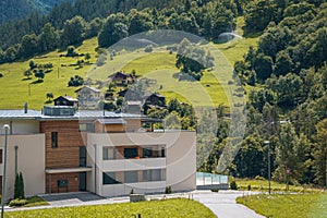 Landscape Scenery View, Switzerland. Modern cottage or hotel in small village.