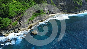 Landscape with scenic rocks and blue ocean with waves in Hawaii. Aerial view