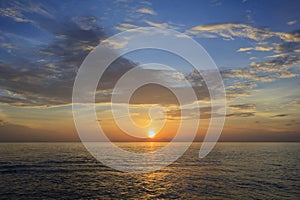 Landscape of sea beach and cloudy sky at dawn