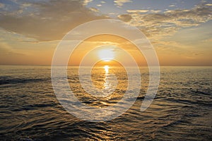 Landscape of sea beach and cloudy sky at dawn