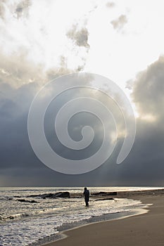 Landscape of sea, beach and cloudy sky which has sun beam