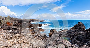 Landscape of sea, cliff blue sky with clouds. Ocean coast in the