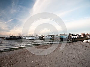 Landscape sea front house row in distance beach