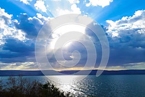 Landscape Sea of Galilee - Sea of Galilee. Clouds above the lake. The sun`s rays break through the clouds