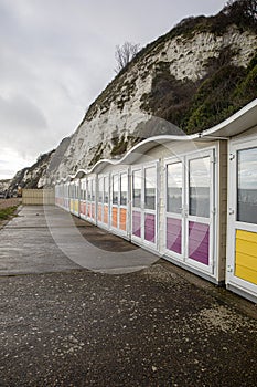 Landscape by the sea. Row of beach huts in Eastbourne East Sussex England UK