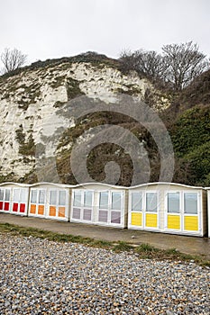 Landscape by the sea. Row of beach huts in Eastbourne East Sussex England UK