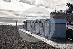 Landscape by the sea. Row of beach huts in Eastbourne East Sussex England UK