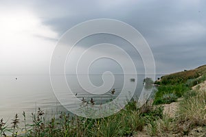 Landscape with sea and sand dune shore, shore slip, calm water, Curonian Spit, Nida