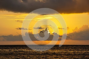 Landscape of the sea under a cloudy sky during the sunset - great for backgrounds