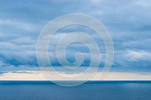 Landscape of the sea, view of the horizon, heavy rain clouds