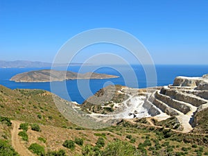 Landscape and seascape of Crete with view of gypsum quarry