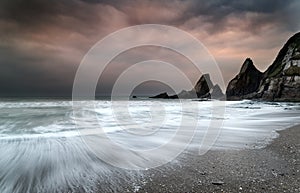 Landscape seascape of jagged and rugged rocks on coastline with