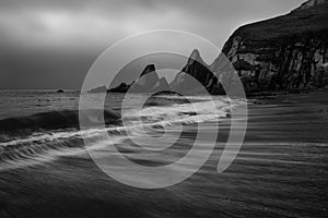 Landscape seascape of jagged and rugged rocks on coastline with