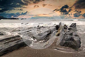 Landscape seascape of jagged and rugged rocks on coastline with