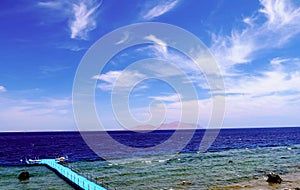 Landscape Seascape view from the beach on the island pontoon bridge with lifeguards